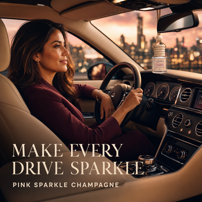 Woman driving at sunset with a small QIAWI Pink Sparkle Champagne car diffuser