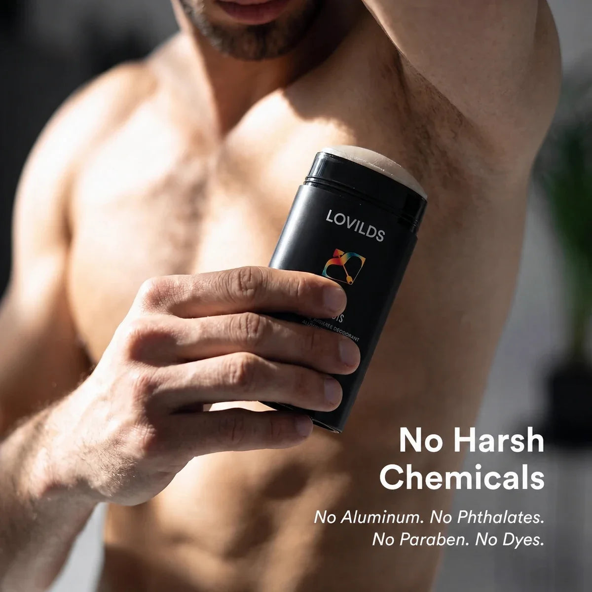 Man applying LOVILDS Hypnosis aluminum-free deodorant with no harsh chemicals message