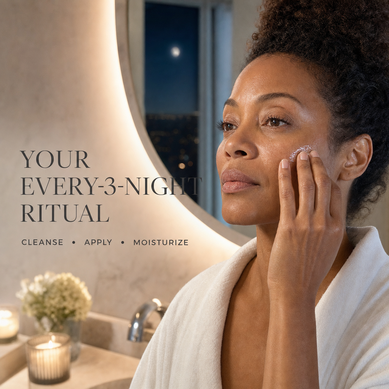 Black woman pressing serum into her cheek during an every-three-night skincare ritual